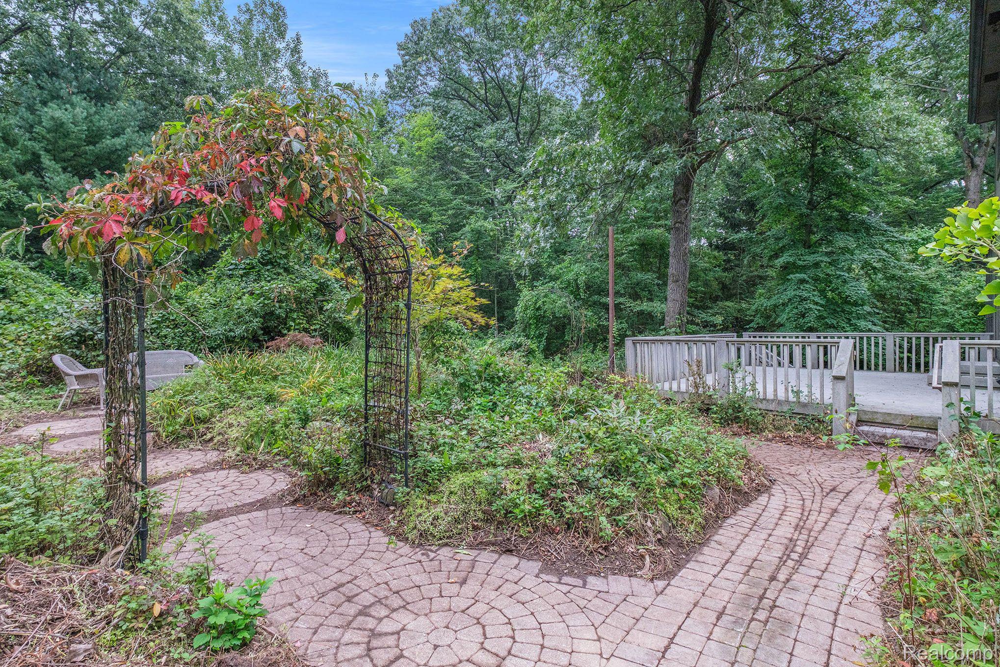 727 South Van Road Holly, MI 48442 - Photo 32 of 42 Trex Deck to Brick Paver Paradise!