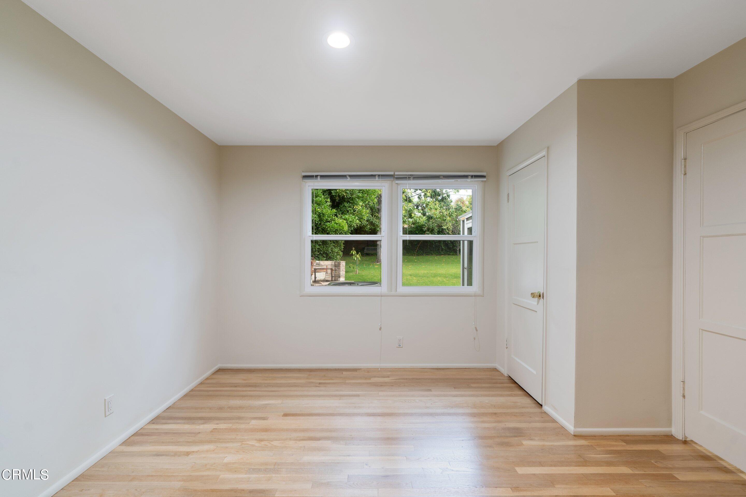 3815 Mayfair Drive Pasadena, CA 91107 - Photo 15 of 38 a view of an empty room with wooden floor and a window