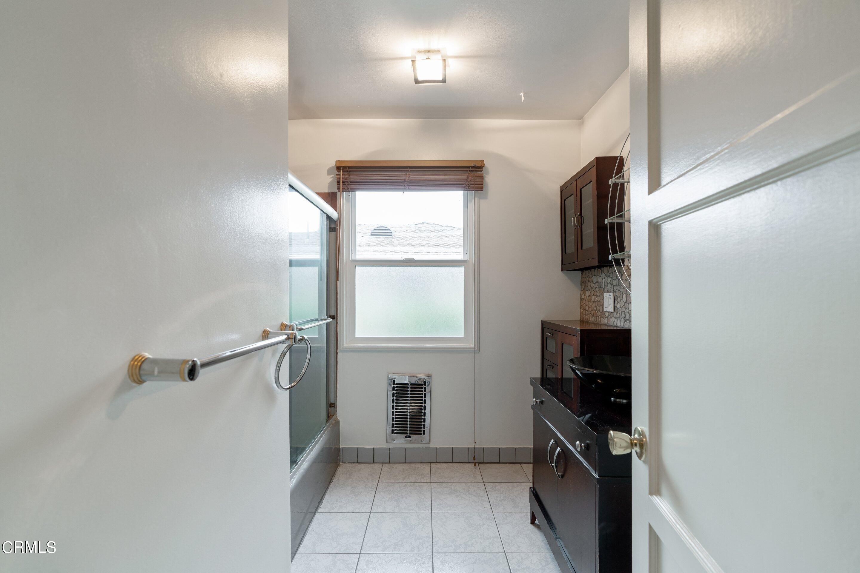 3815 Mayfair Drive Pasadena, CA 91107 - Photo 21 of 38 a view of empty room with a fireplace and windows