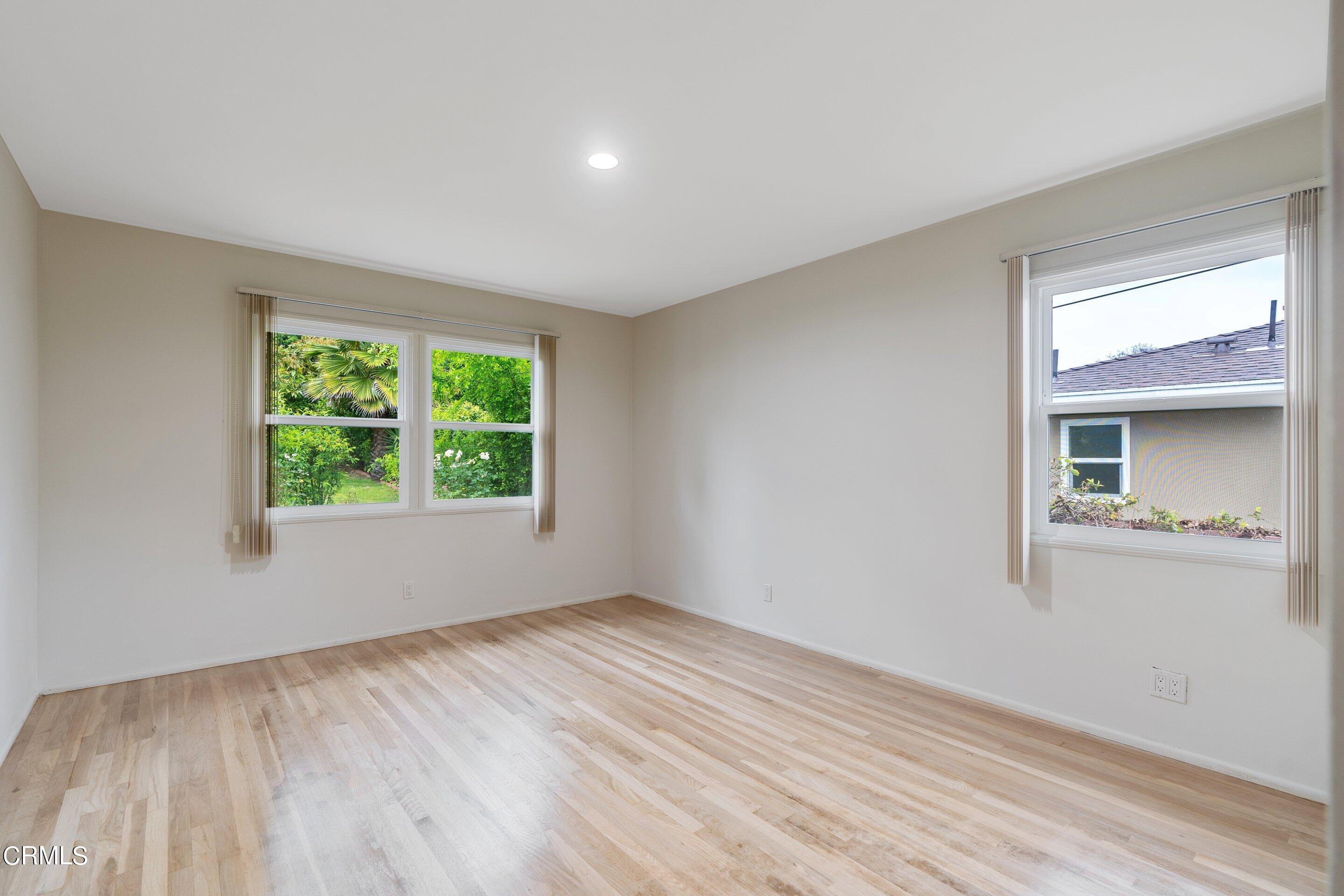 3815 Mayfair Drive Pasadena, CA 91107 - Photo 24 of 38 a view of an empty room with wooden floor and a window