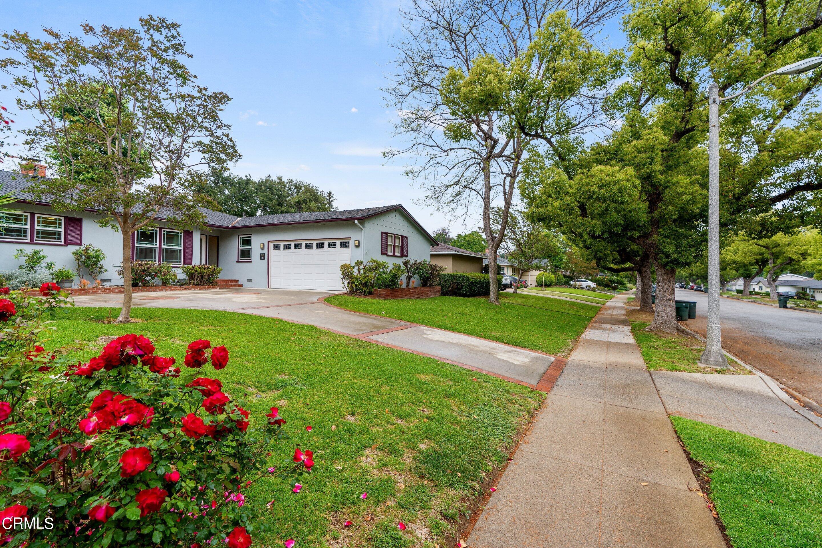 3815 Mayfair Drive Pasadena, CA 91107 - Photo 4 of 38 a front view of a house with fountain and garden