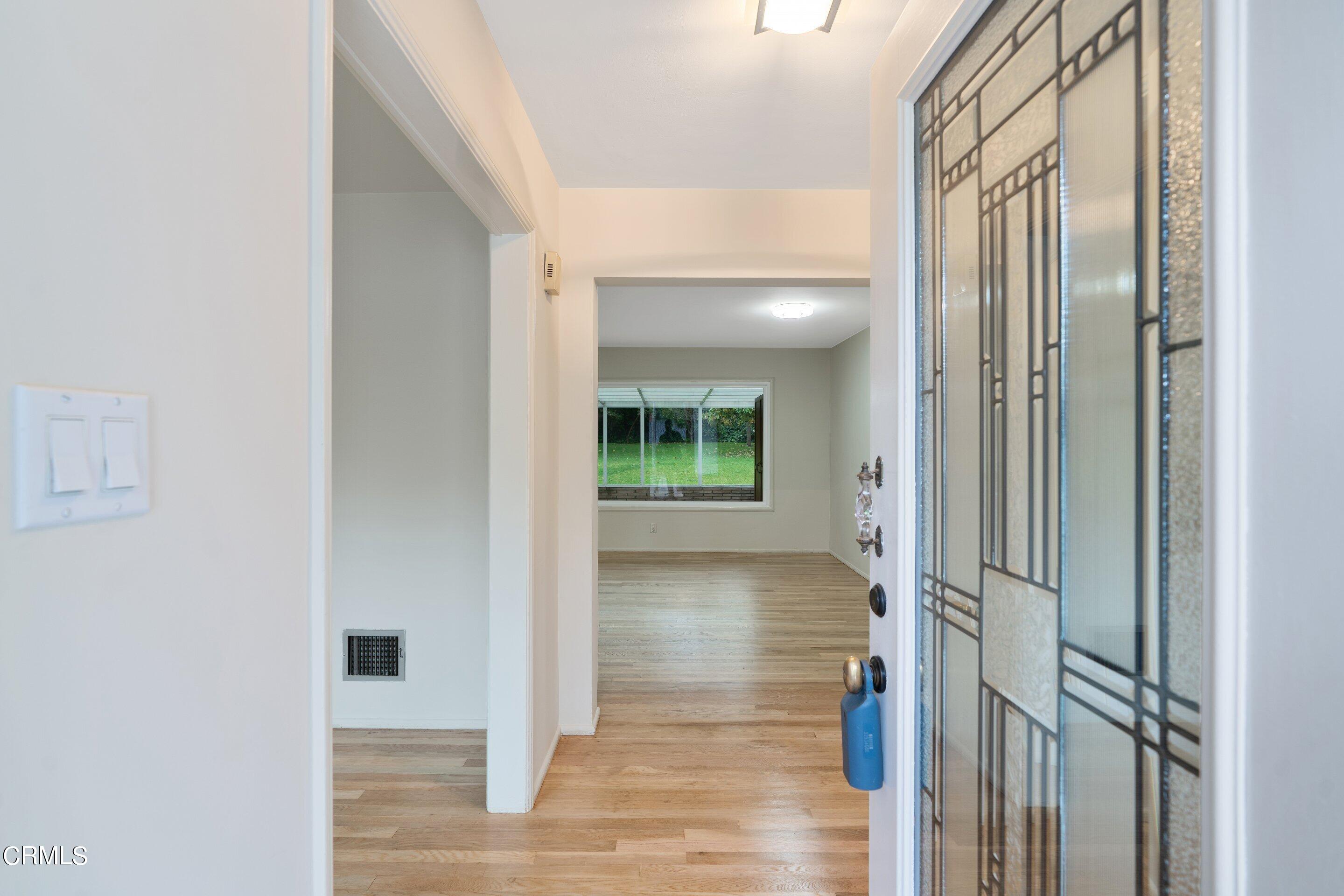 3815 Mayfair Drive Pasadena, CA 91107 - Photo 6 of 38 a view of a hallway with wooden floor and staircase