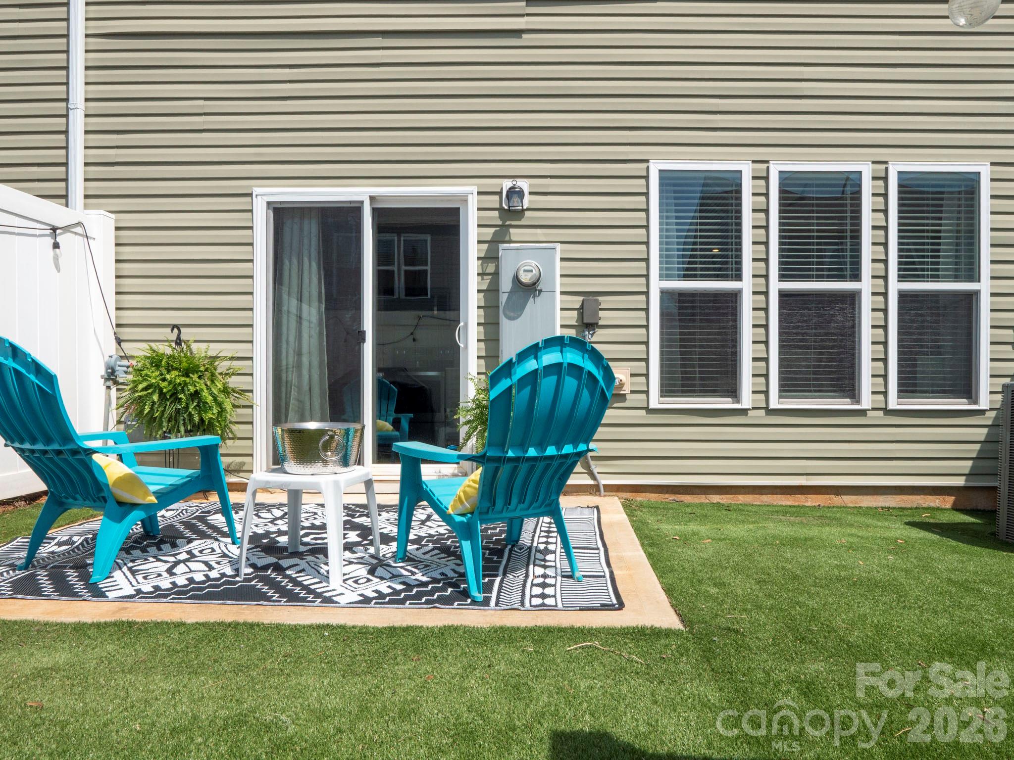 827 Canoe Song Road Fort Mill, SC 29708 - Photo 29 of 33 a view of a chair and table in back yard of the house