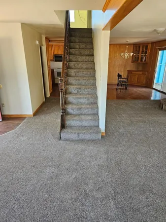 a view of an empty room with stairs