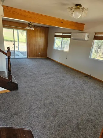 a view of an empty room and window
