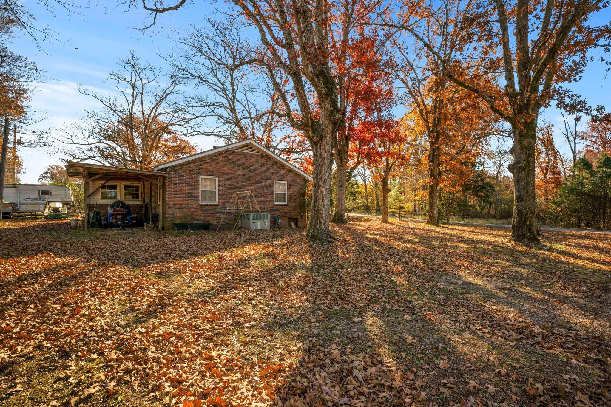 1032 Old State Rte 50 Centerville, TN 37033 - Photo 15 of 33 a front view of a house with a yard covered with snow and trees
