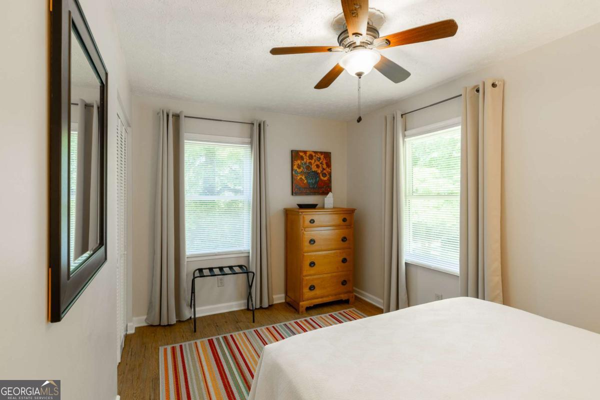 168 Pearl Street Athens, GA 30601 - Photo 20 of 43 a bedroom with a bed dresser and a window