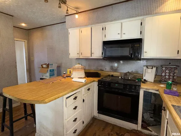 a kitchen with a sink a stove and refrigerator