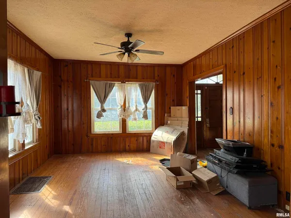 a view of a room with wooden furniture