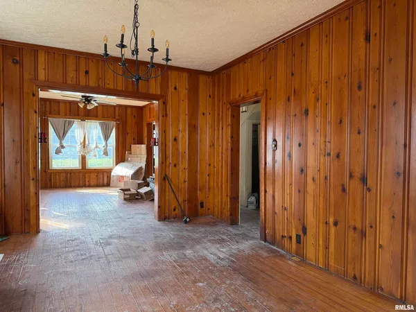 a living room with furniture window and wooden floor