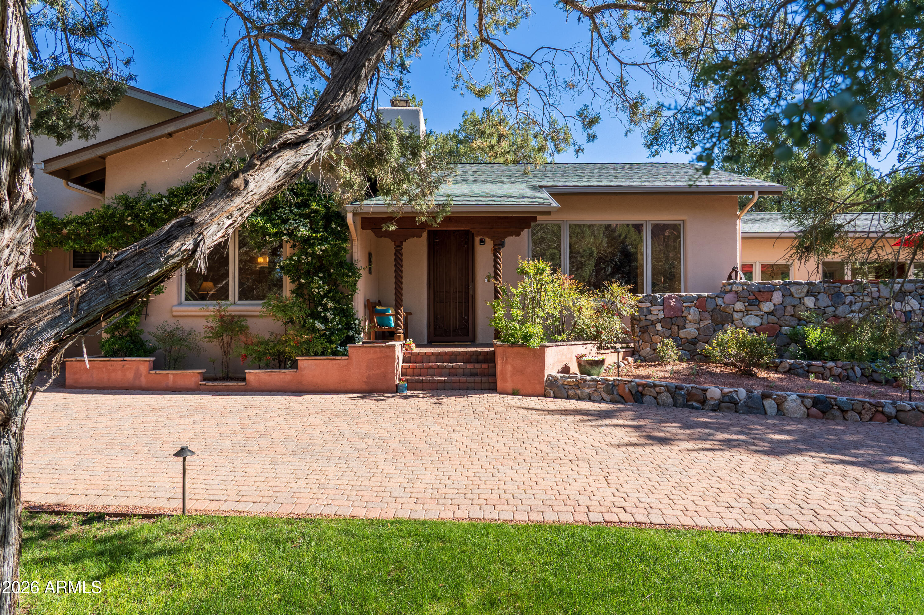 190 Morgan Road Sedona, AZ 86336 - Photo 11 of 51 a view of a house with potted plants and a large tree