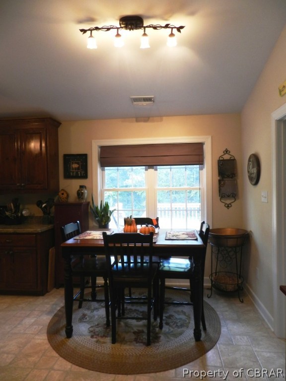 197 Chelsea Road West Point, VA 23181 - Photo 10 of 26 Plenty of room for a table and exceptional track lighting.
