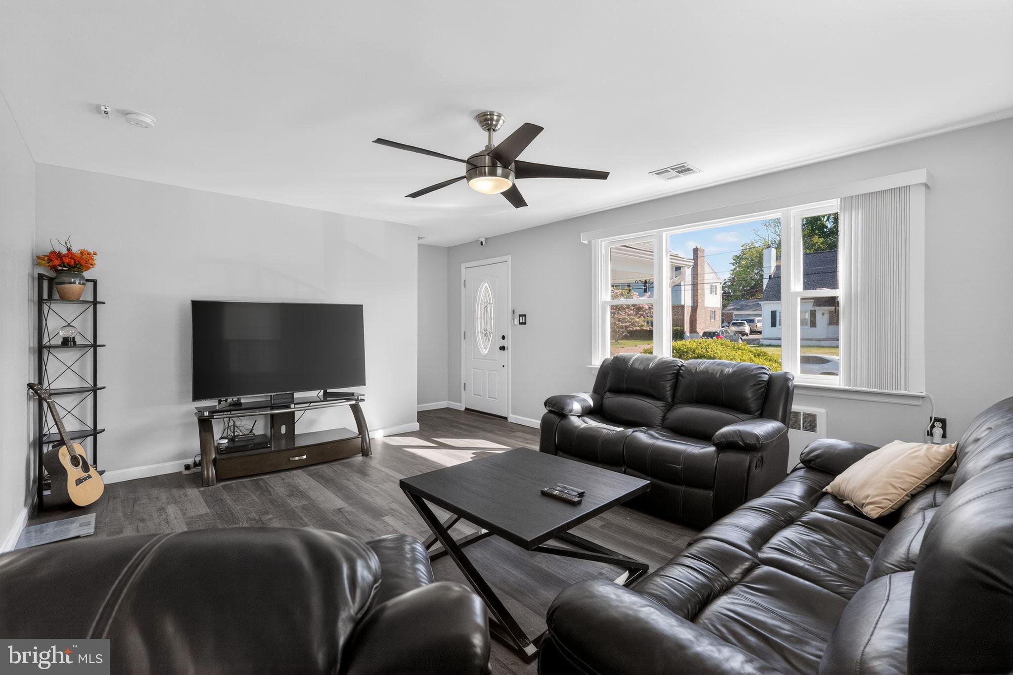 110 McCormick Avenue Ridley Park, PA 19078 - Photo 5 of 29 a living room with furniture and a flat screen tv