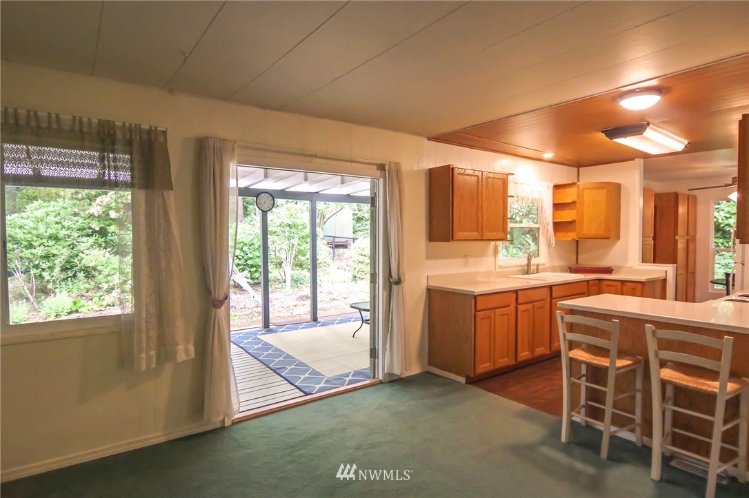 3309 206th Place Southeast Bothell, WA 98012 - Photo 13 of 32 a kitchen with a stove a sink and a refrigerator