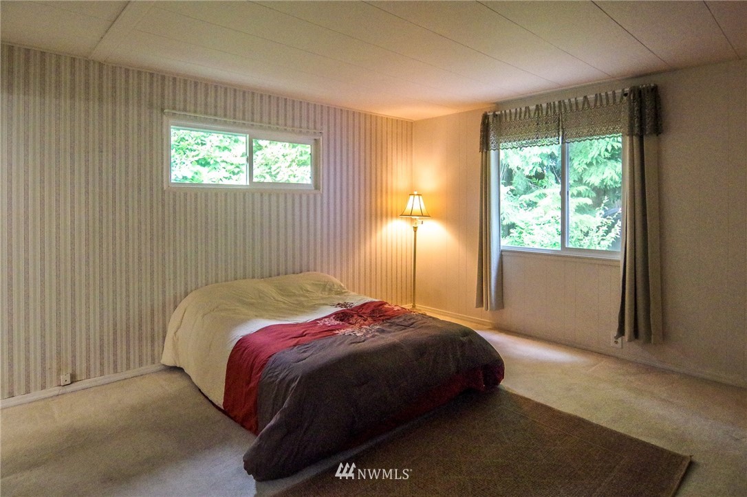 3309 206th Place Southeast Bothell, WA 98012 - Photo 22 of 32 a bedroom with a bed and a window