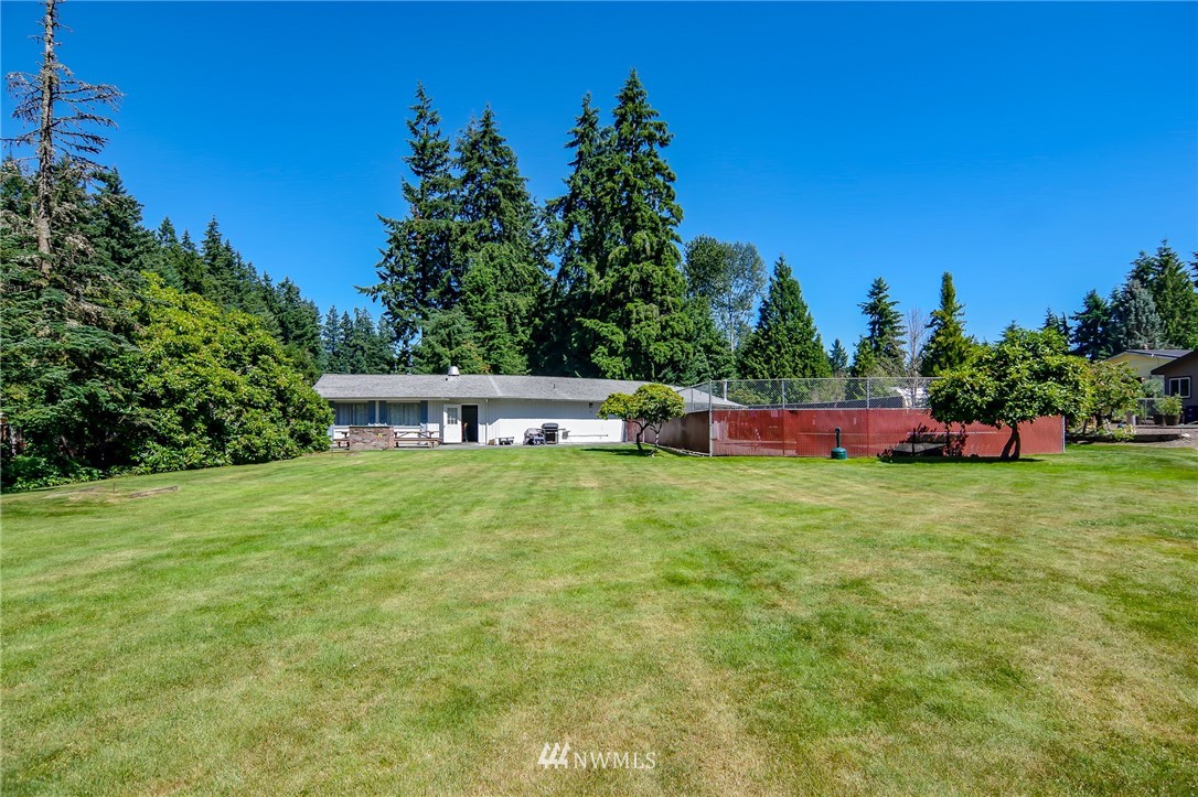 3309 206th Place Southeast Bothell, WA 98012 - Photo 25 of 32 a front view of a house with a yard