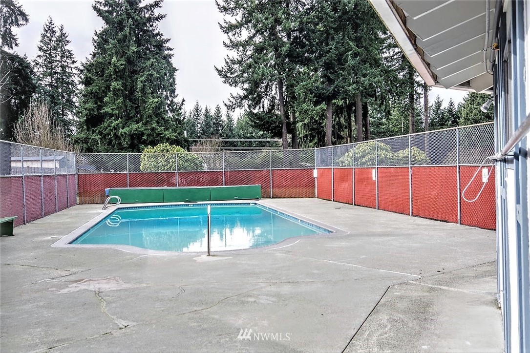3309 206th Place Southeast Bothell, WA 98012 - Photo 30 of 32 a view of a tennis court with lots of trees in the background