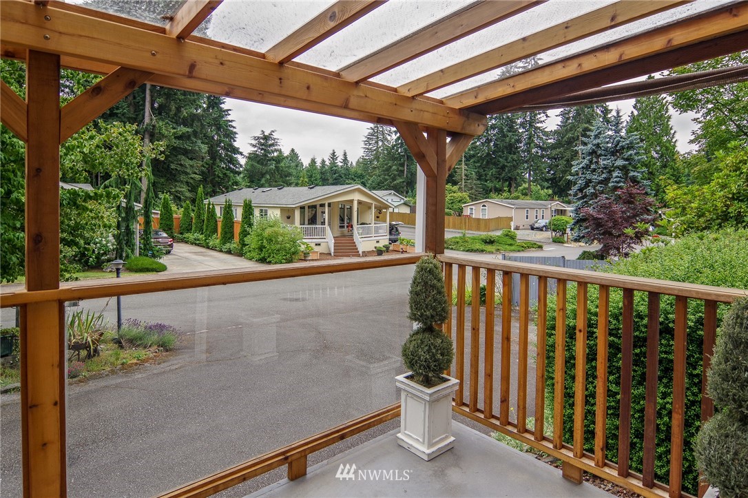 3309 206th Place Southeast Bothell, WA 98012 - Photo 4 of 32 a porch with a table in the back yard