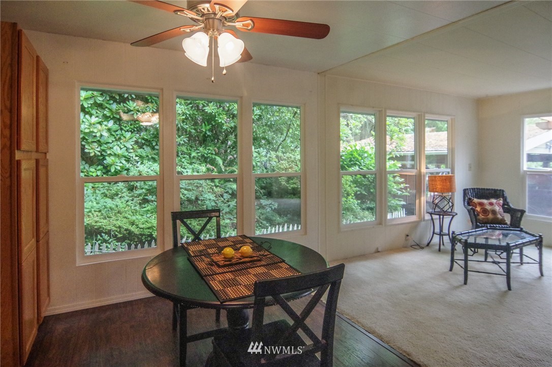 3309 206th Place Southeast Bothell, WA 98012 - Photo 9 of 32 a living room with furniture a table and a large window