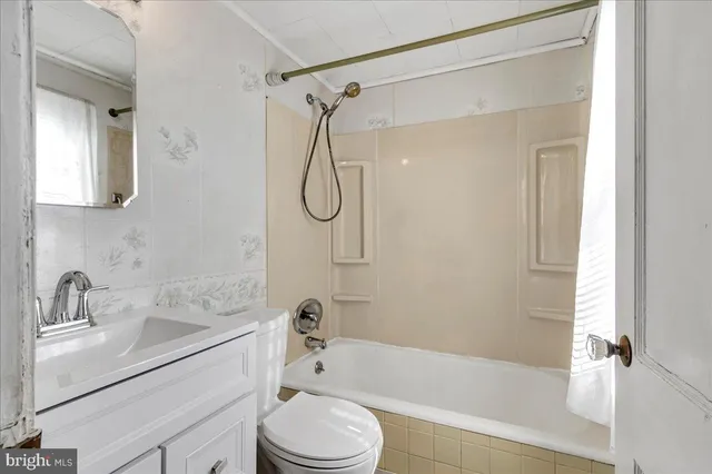 a bathroom with a sink a toilet and a bathtub