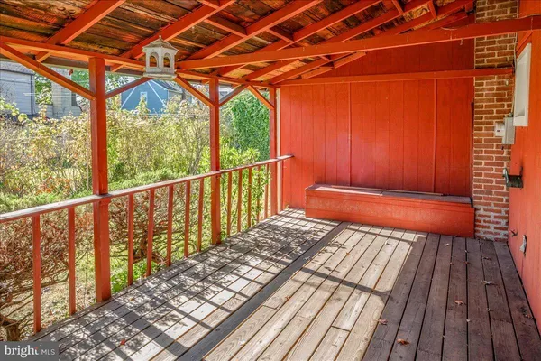 a balcony with wooden floor