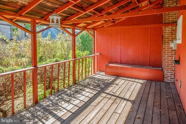 a balcony with wooden floor