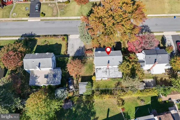an aerial view of house with yard swimming pool and outdoor seating