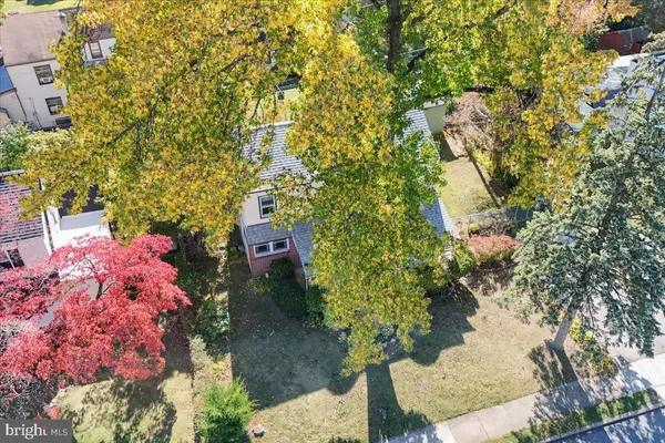an aerial view of residential house with outdoor space and swimming pool
