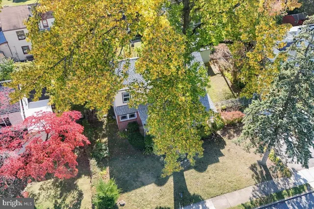 an aerial view of residential house with outdoor space and swimming pool