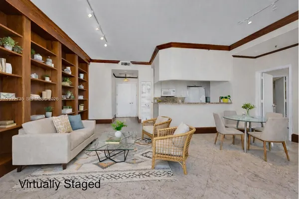 a living room with furniture and a rug