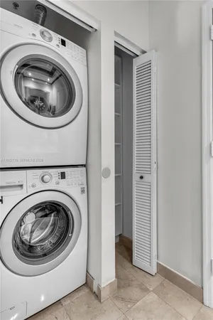a utility room with sink dryer and washer