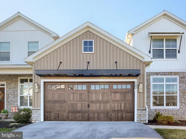 a front view of a house with garage