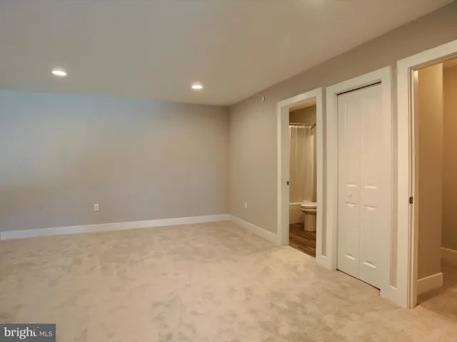 an empty room with closet area