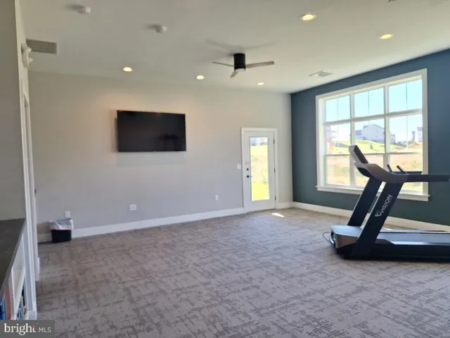 a living room with lots of furniture and a dining table