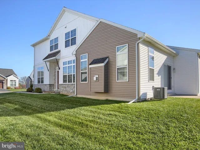 a house that is sitting in the grass