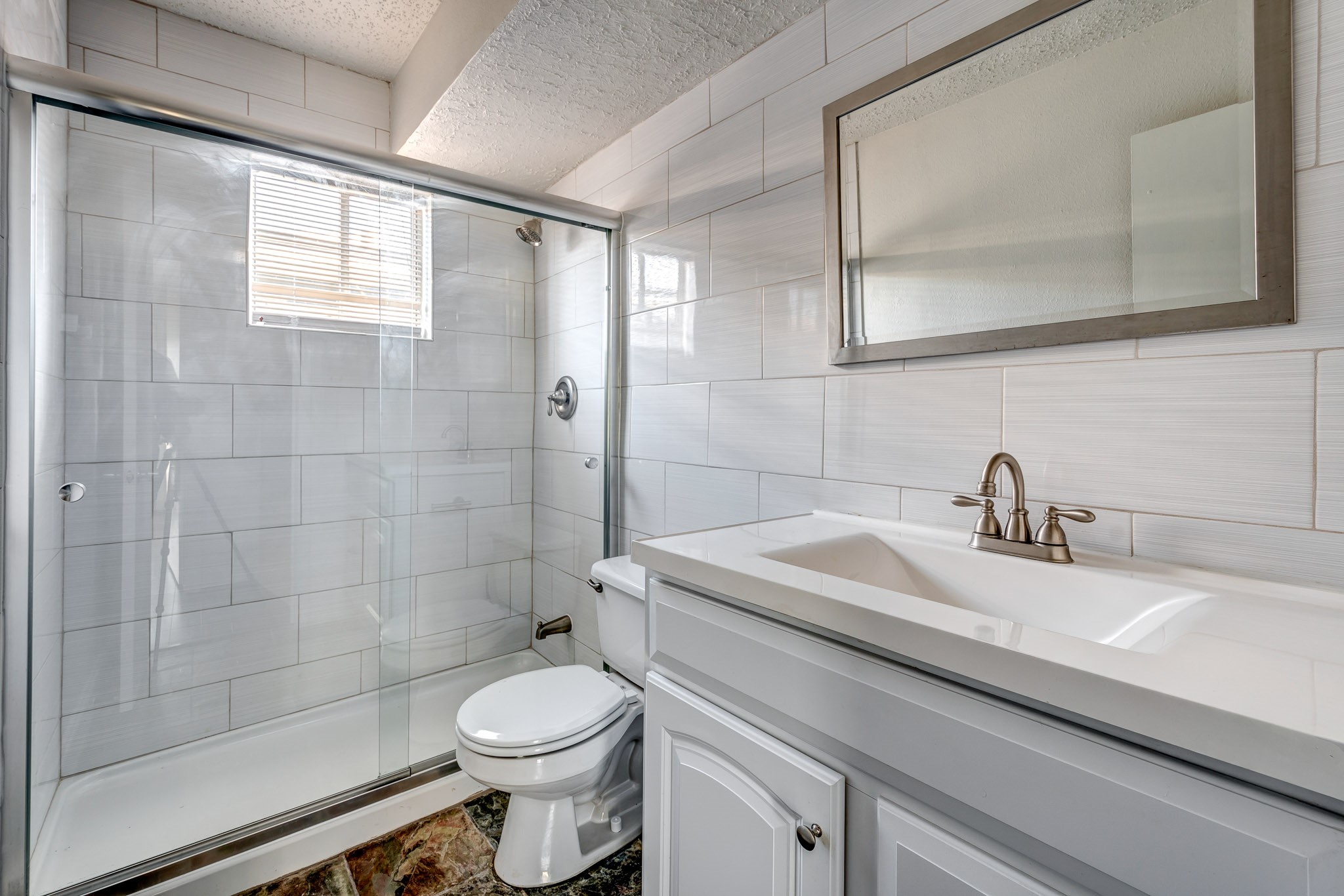 4321 Hazard Street, Unit 9 Houston, TX 77098 - Photo 4 of 8 a bathroom with a sink a toilet and shower
