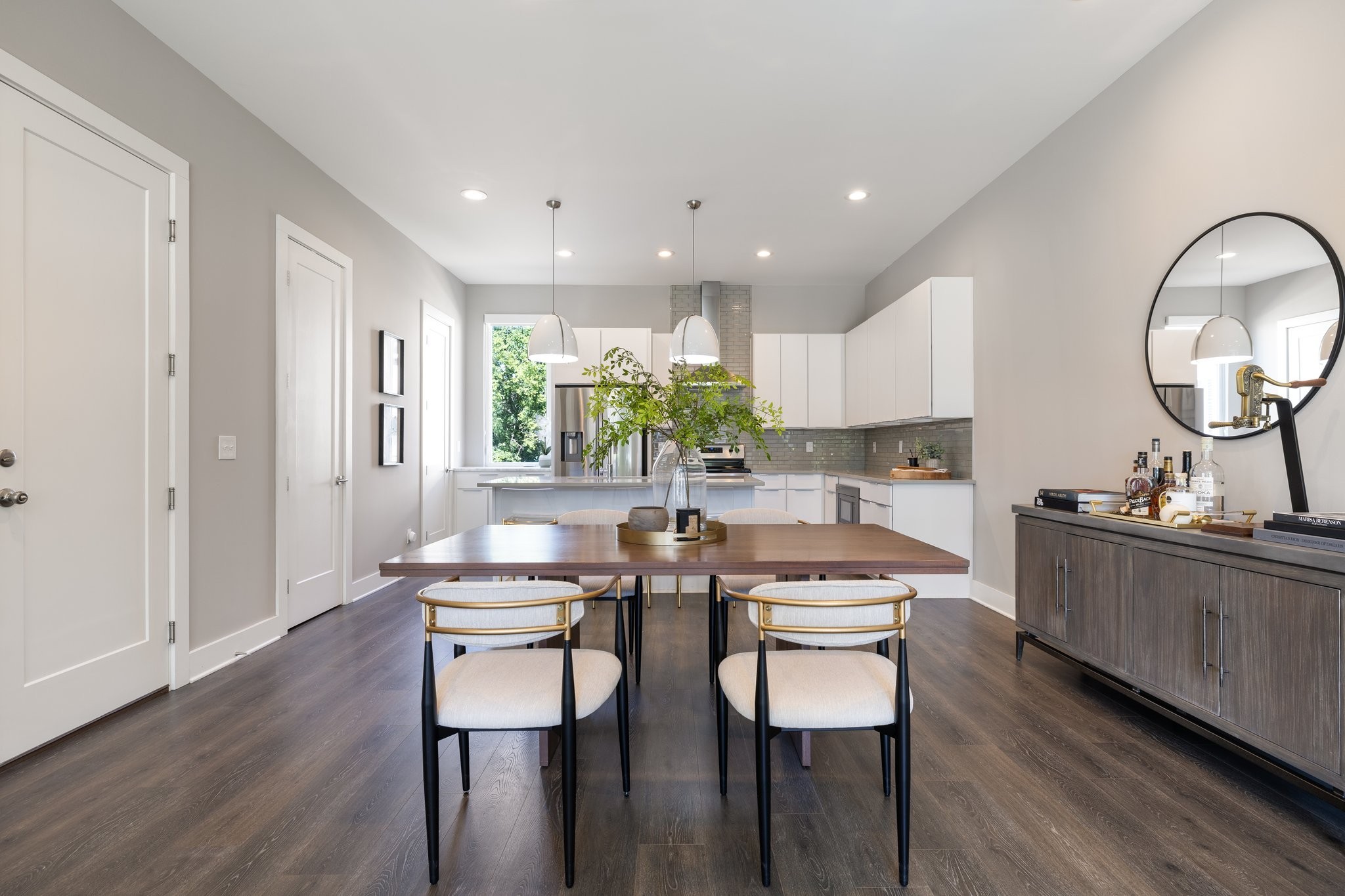 1300 Lischey Avenue, Unit 2 Nashville, TN 37207 - Photo 12 of 55 a kitchen with stainless steel appliances kitchen island granite countertop a stove a sink a dining table and chairs