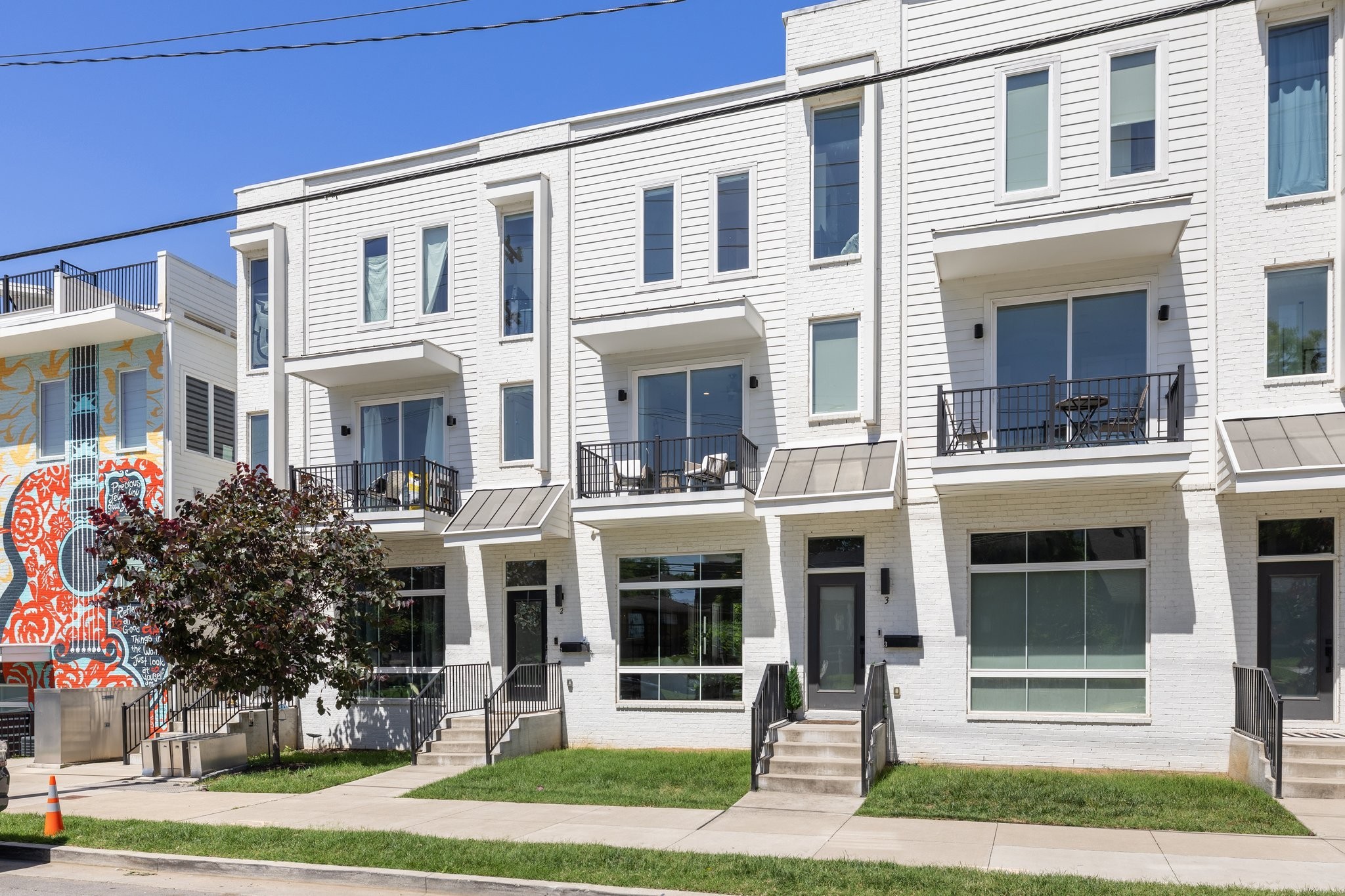 1300 Lischey Avenue, Unit 2 Nashville, TN 37207 - Photo 2 of 55 a front view of a residential apartment building with a yard