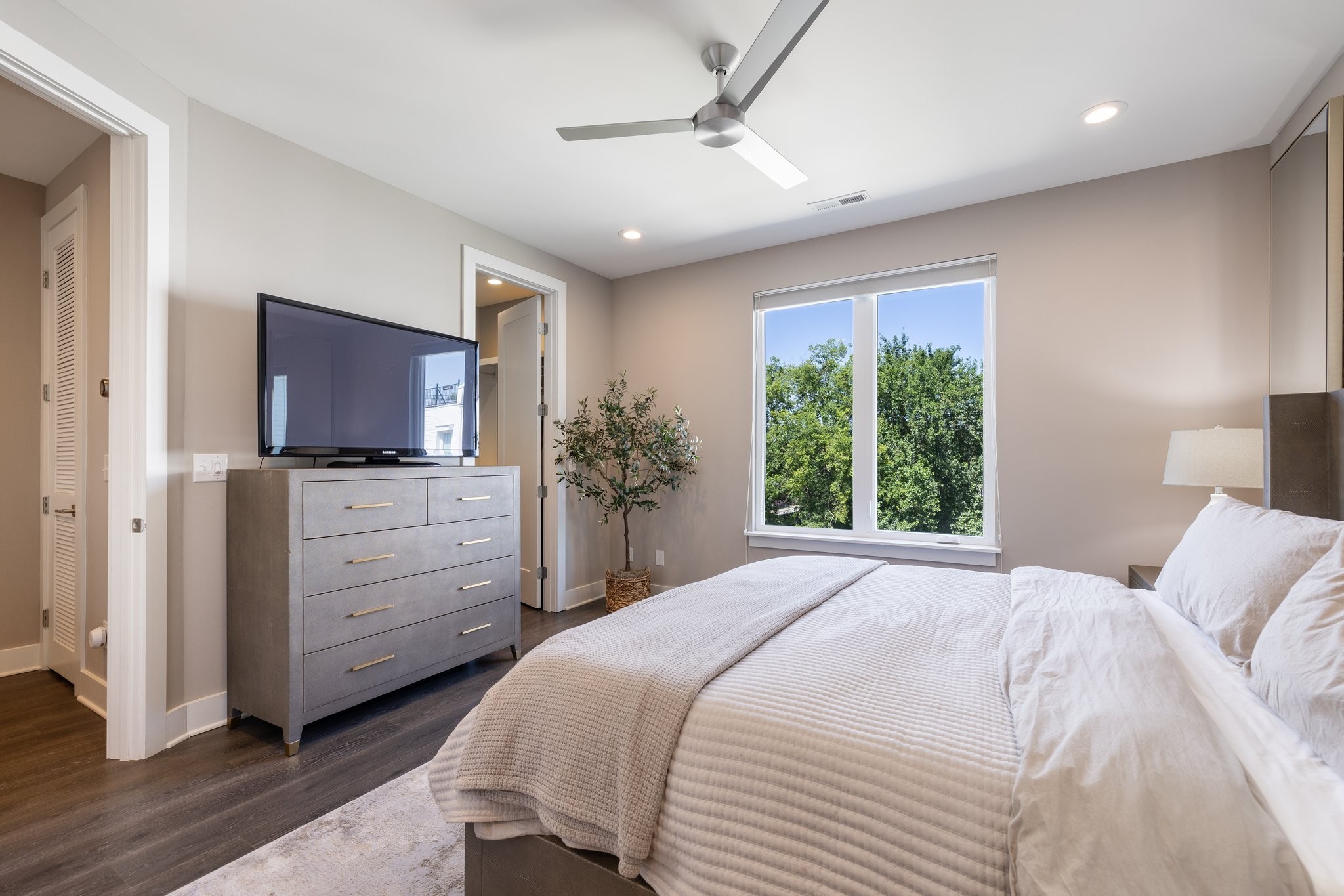 1300 Lischey Avenue, Unit 2 Nashville, TN 37207 - Photo 23 of 55 a bedroom with a large bed and a flat tv screen on dresser