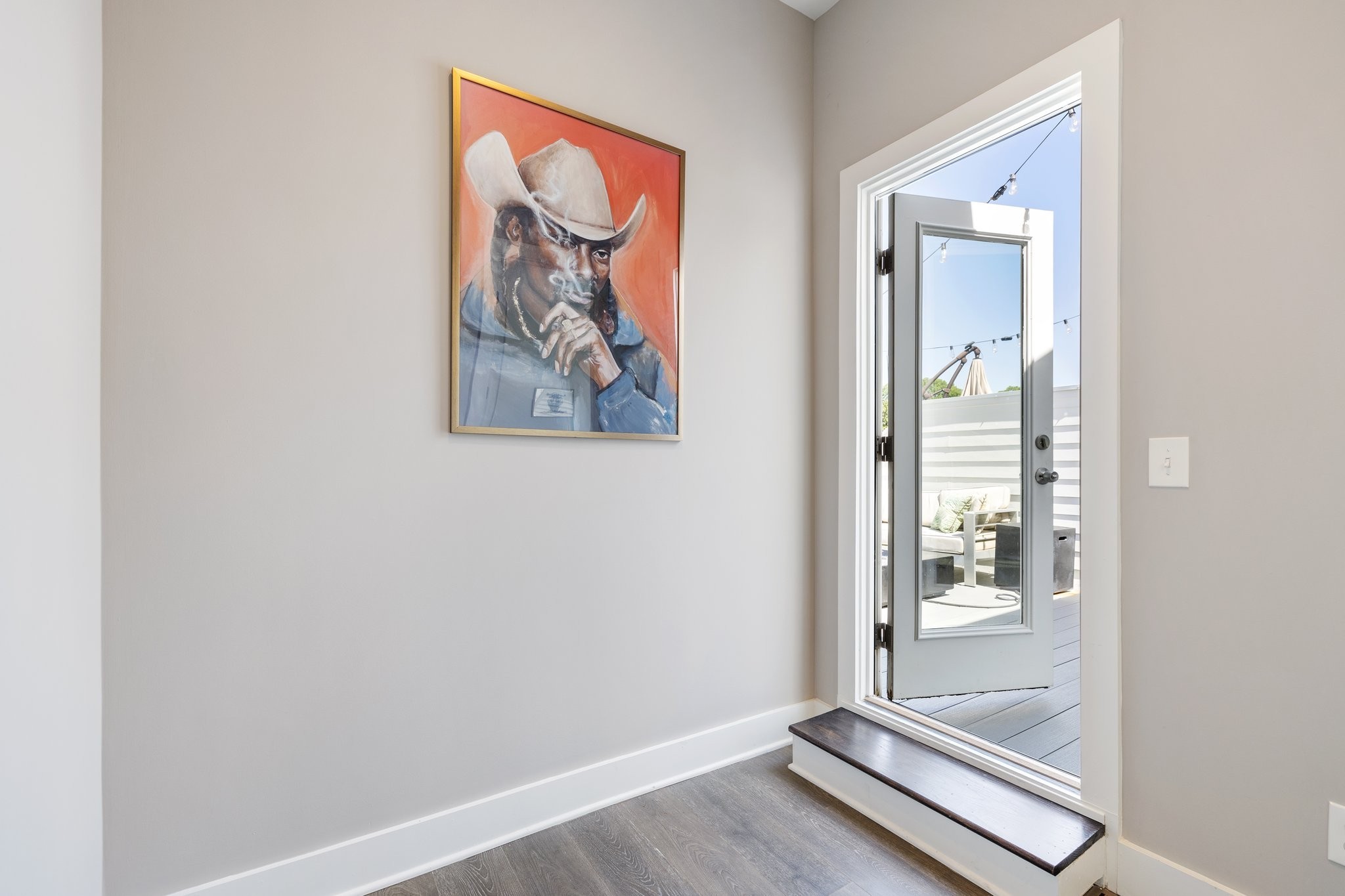 1300 Lischey Avenue, Unit 2 Nashville, TN 37207 - Photo 38 of 55 an empty room with a floor to ceiling window and wooden floor