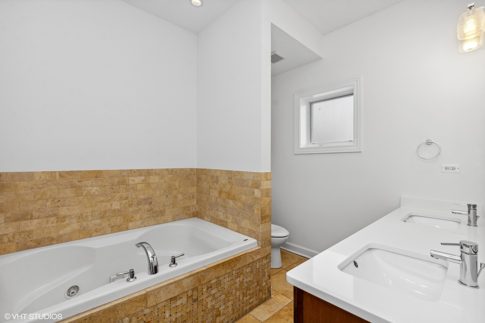 2130 West Rice Street, Unit 3 Chicago, IL 60622 - Photo 11 of 18 a bathroom with a tub a sink and a window