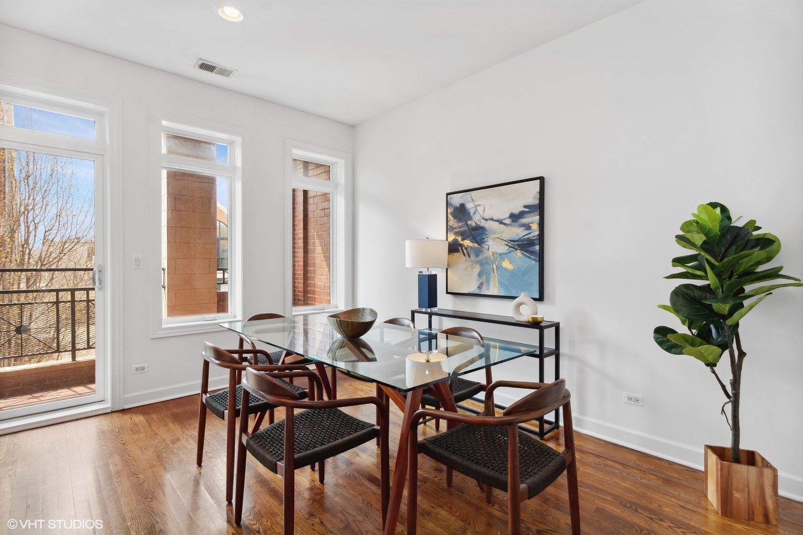 2130 West Rice Street, Unit 3 Chicago, IL 60622 - Photo 9 of 18 a dining room with furniture and wooden floor