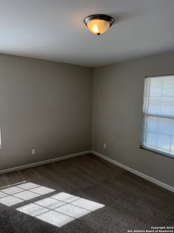 an empty room with a empty space and a window