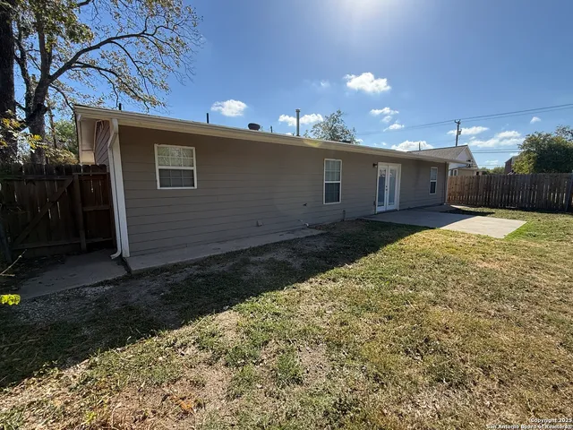 a view of a backyard of the house
