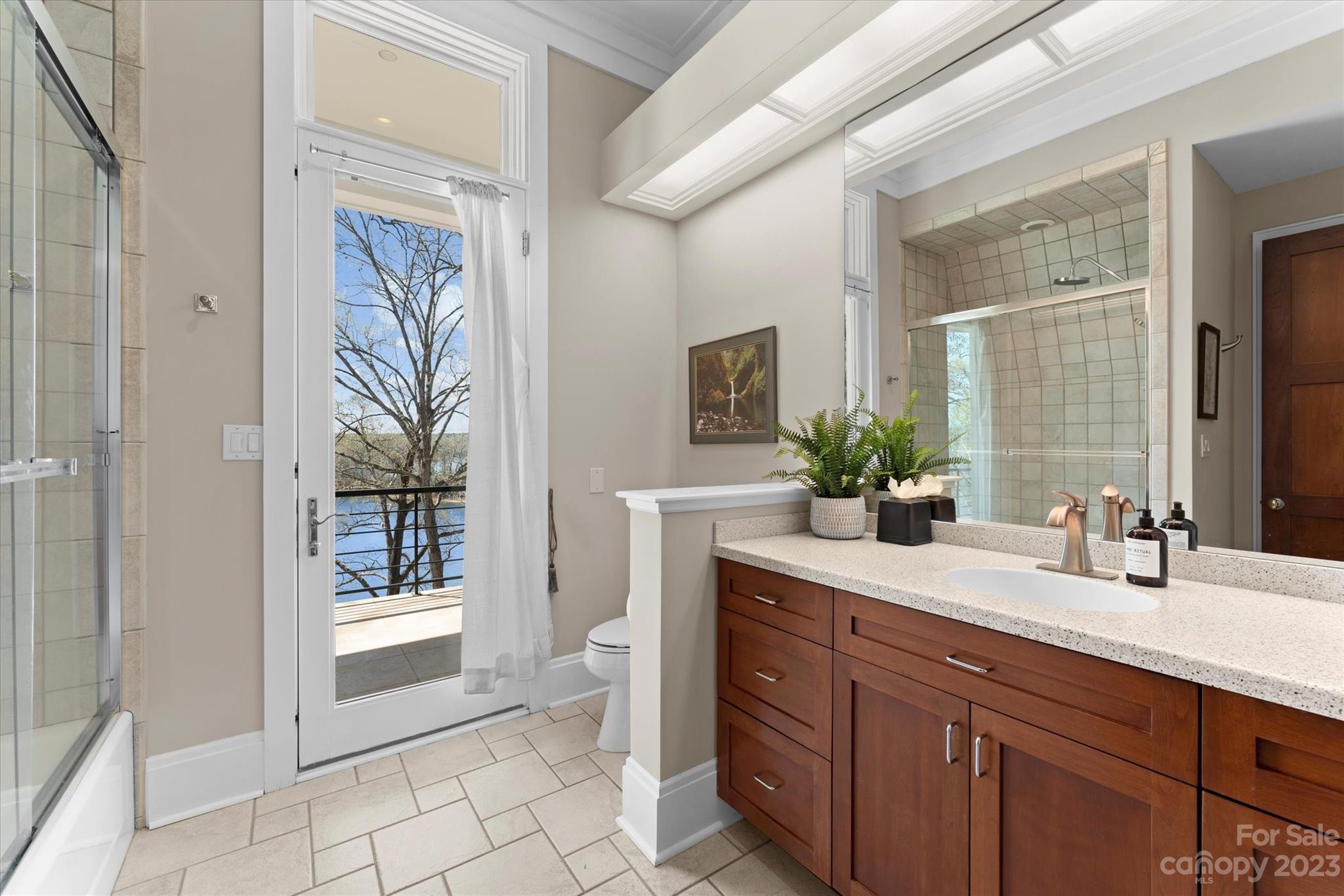 101 Island Ridge Drive Statesville, NC 28677 - Photo 24 of 48 a spacious bathroom with a granite countertop sink a mirror and a bathtub