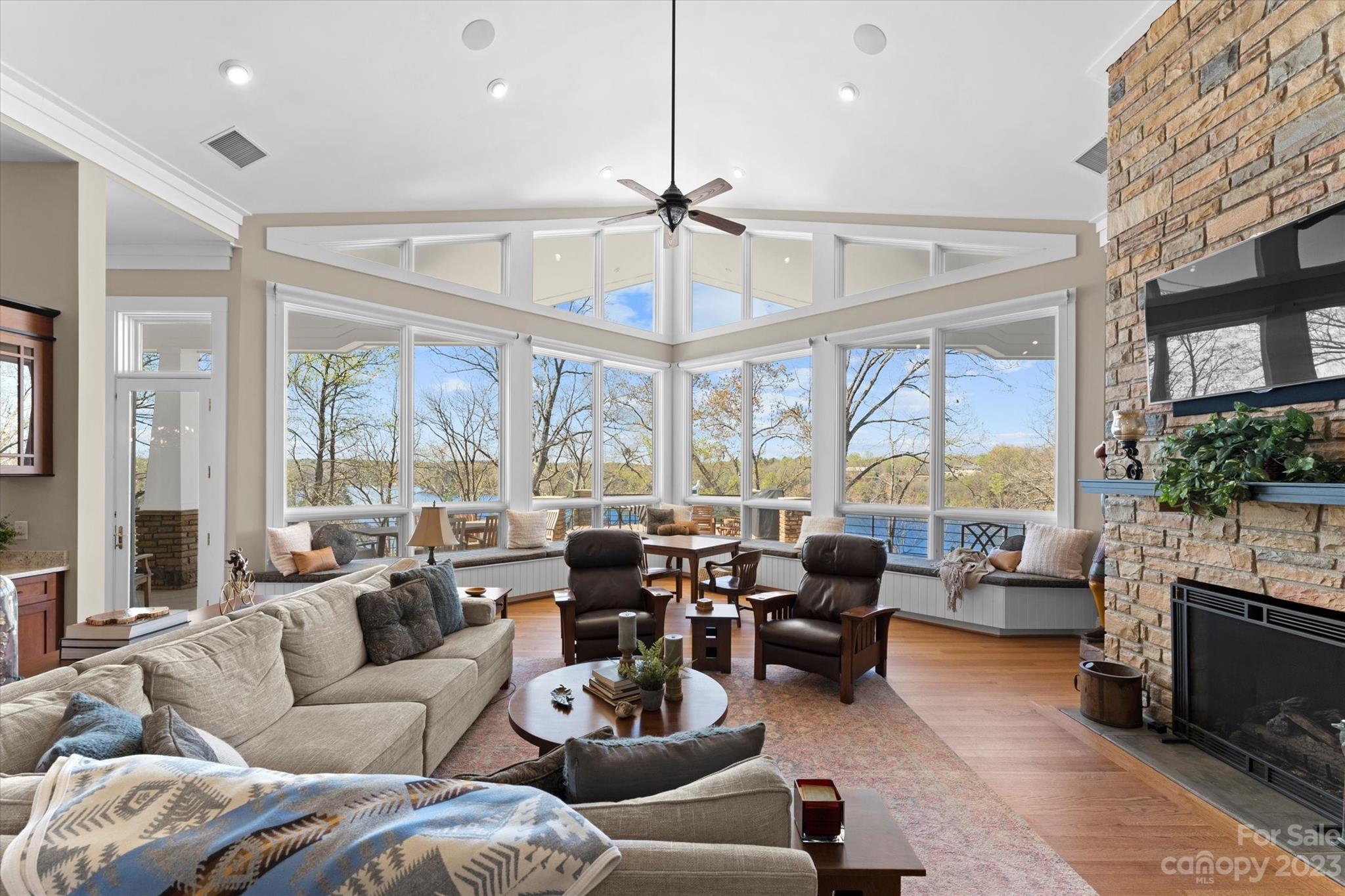 101 Island Ridge Drive Statesville, NC 28677 - Photo 10 of 48 a living room with furniture large windows and a chandelier