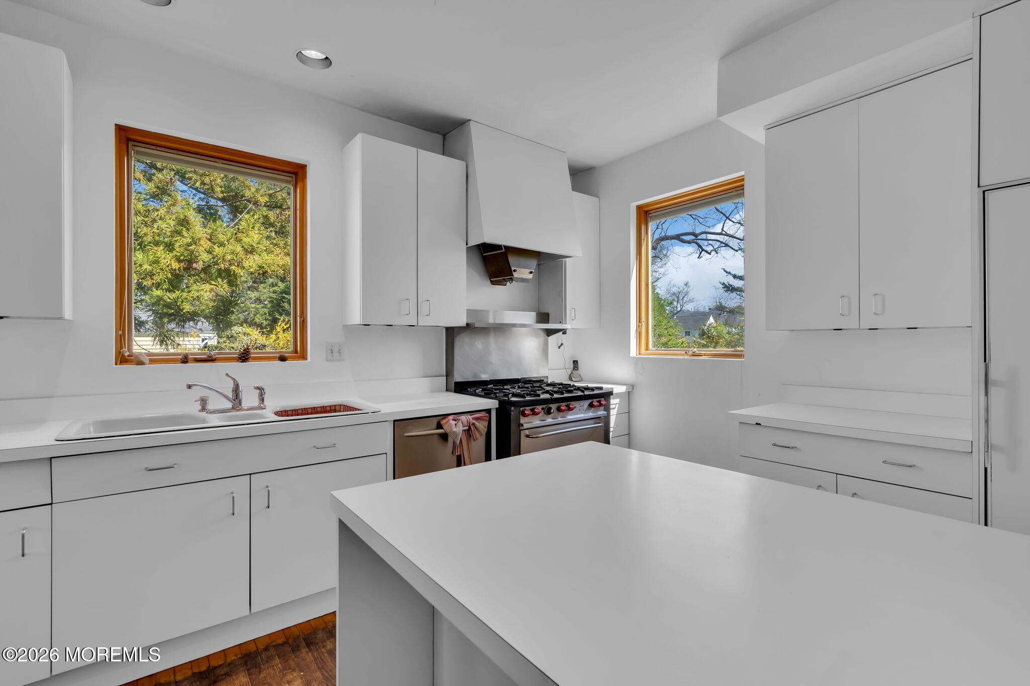 608 Rankin Road Brielle, NJ 08730 - Photo 11 of 27 a kitchen with stainless steel appliances a stove a sink and a refrigerator