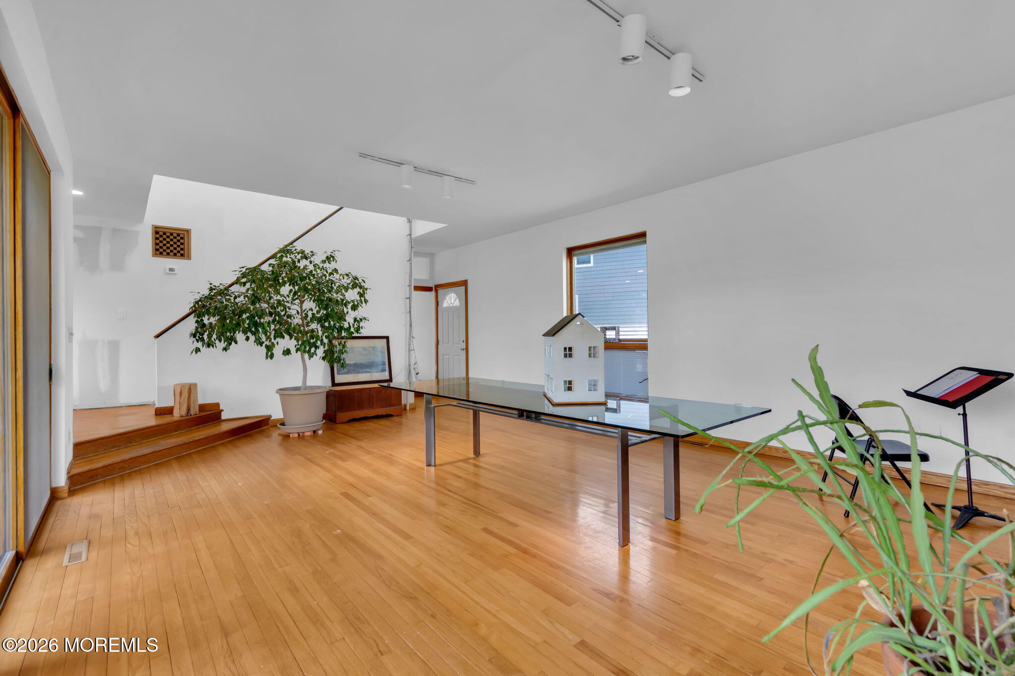 608 Rankin Road Brielle, NJ 08730 - Photo 13 of 27 a view of a room with gym equipment and wooden floor
