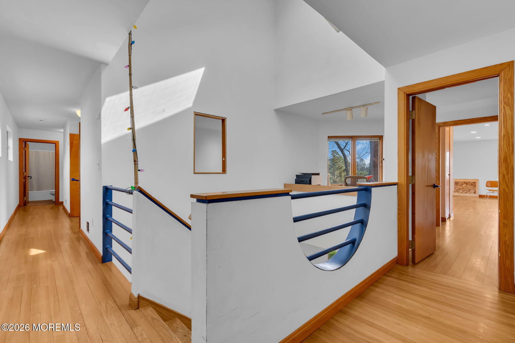 608 Rankin Road Brielle, NJ 08730 - Photo 15 of 27 a view of a hallway with furniture and wooden floor