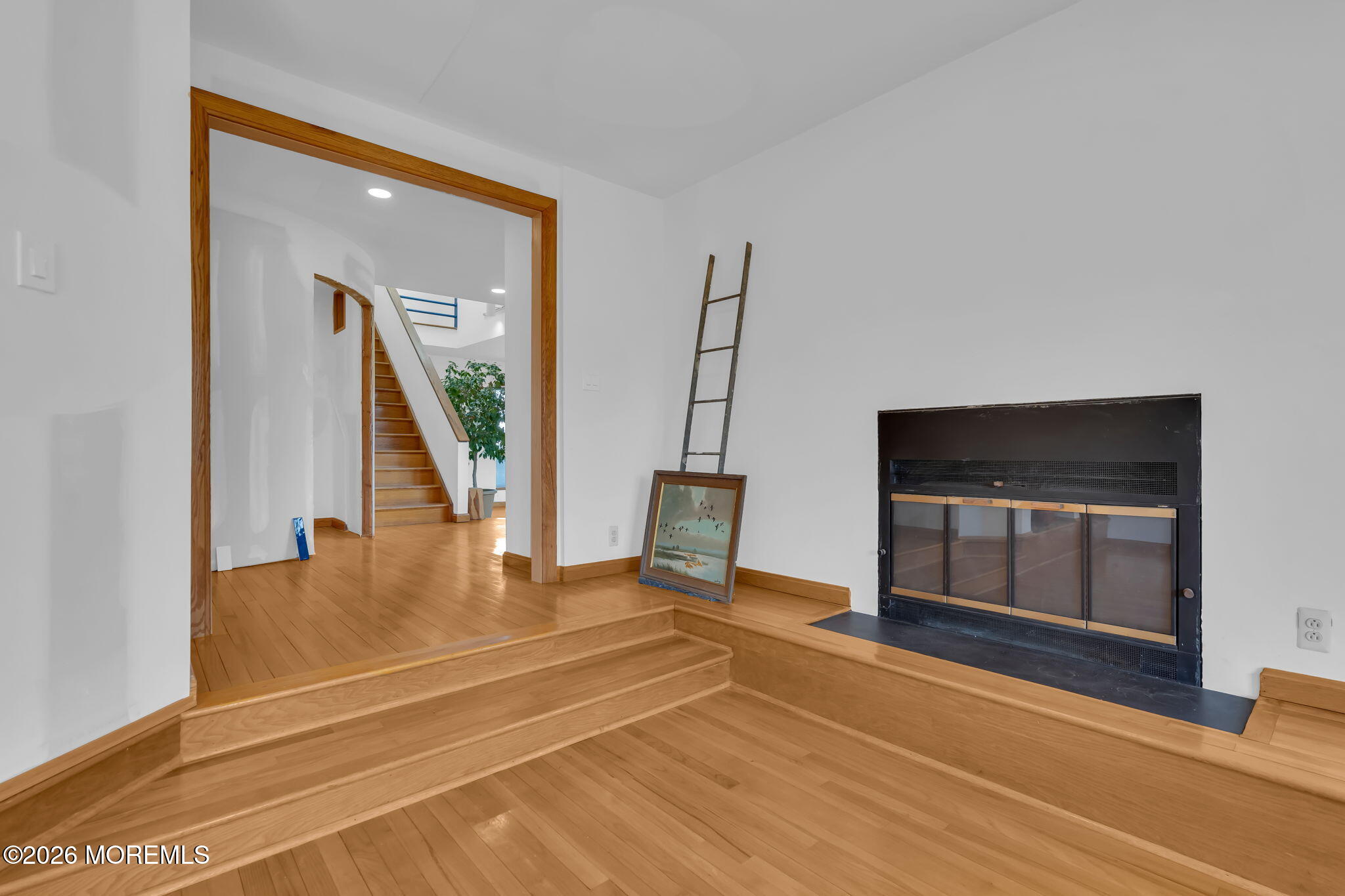 608 Rankin Road Brielle, NJ 08730 - Photo 4 of 27 a view of an empty room with wooden floor and a window